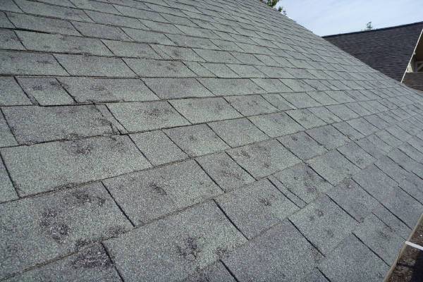 Roofing system in need of a roof replacement