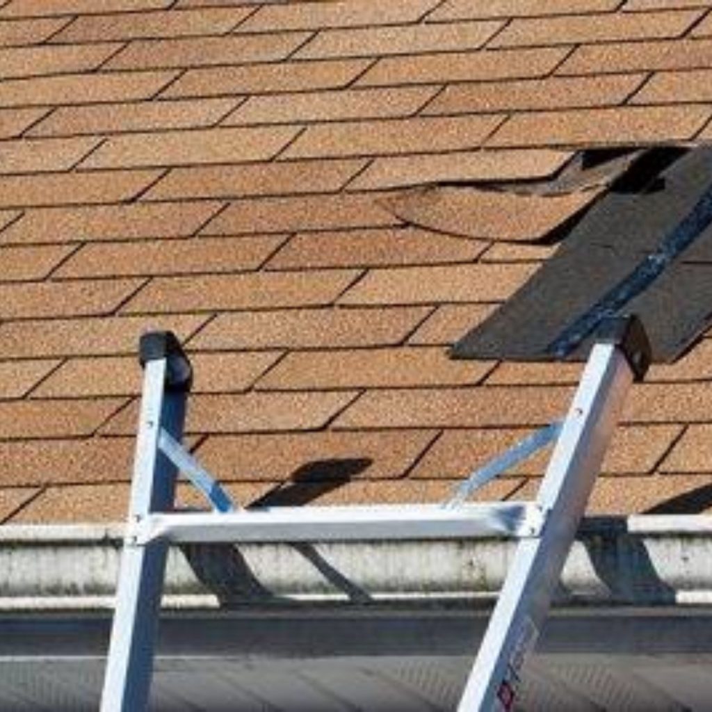 Loose shingles on a roof top