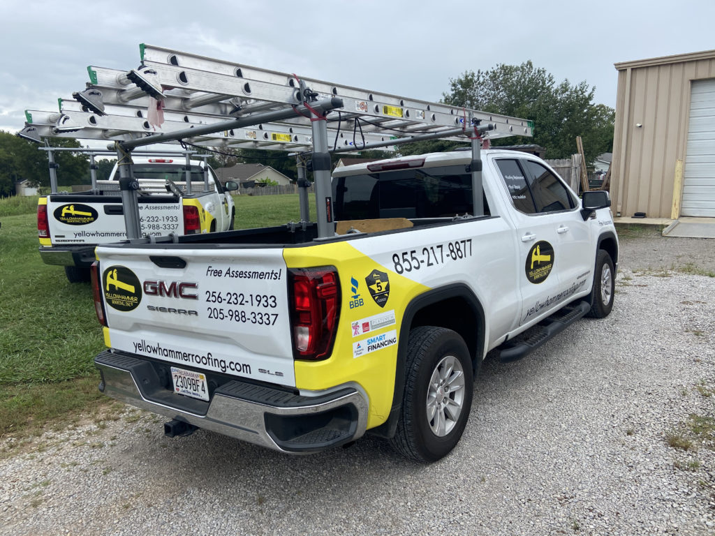 Yellowhammer Roofing Inc. service truck on-site for a emergency storm damage repair. 